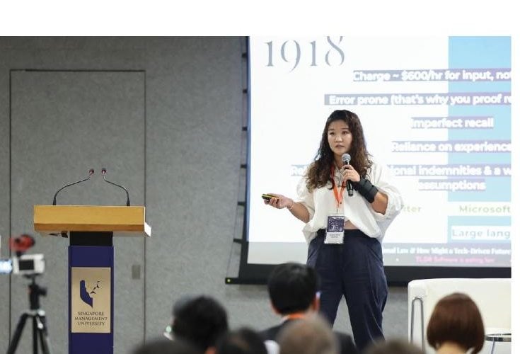 A lecturer presenting to students during a Singapore Management University academic session