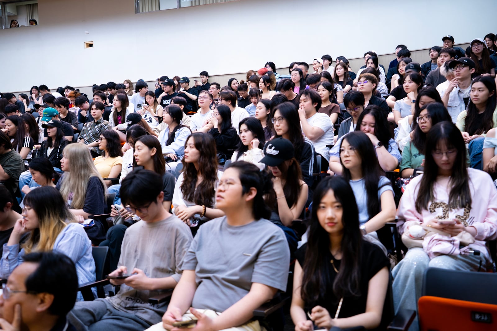 Students gathered in a lecture hall for an academic program